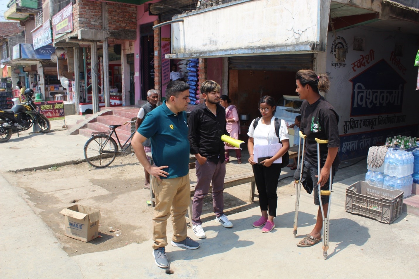 Picture of Santa-Man Tamang with program focal person & Disability Inclusion Officer